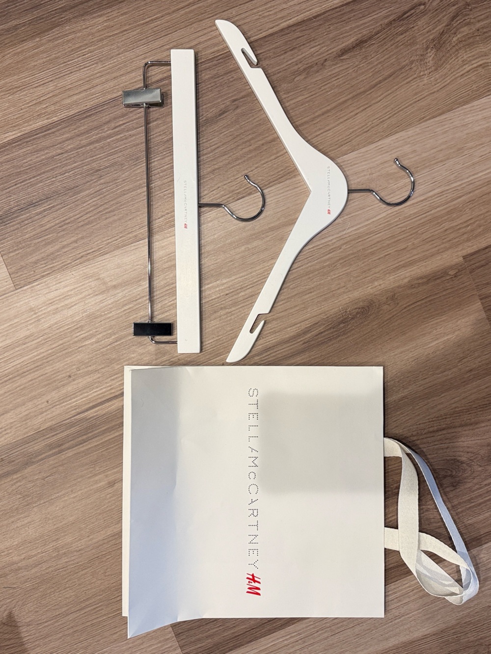 Stella McCartney H&M White Branded Shopping Bag with White Wooden Hangers